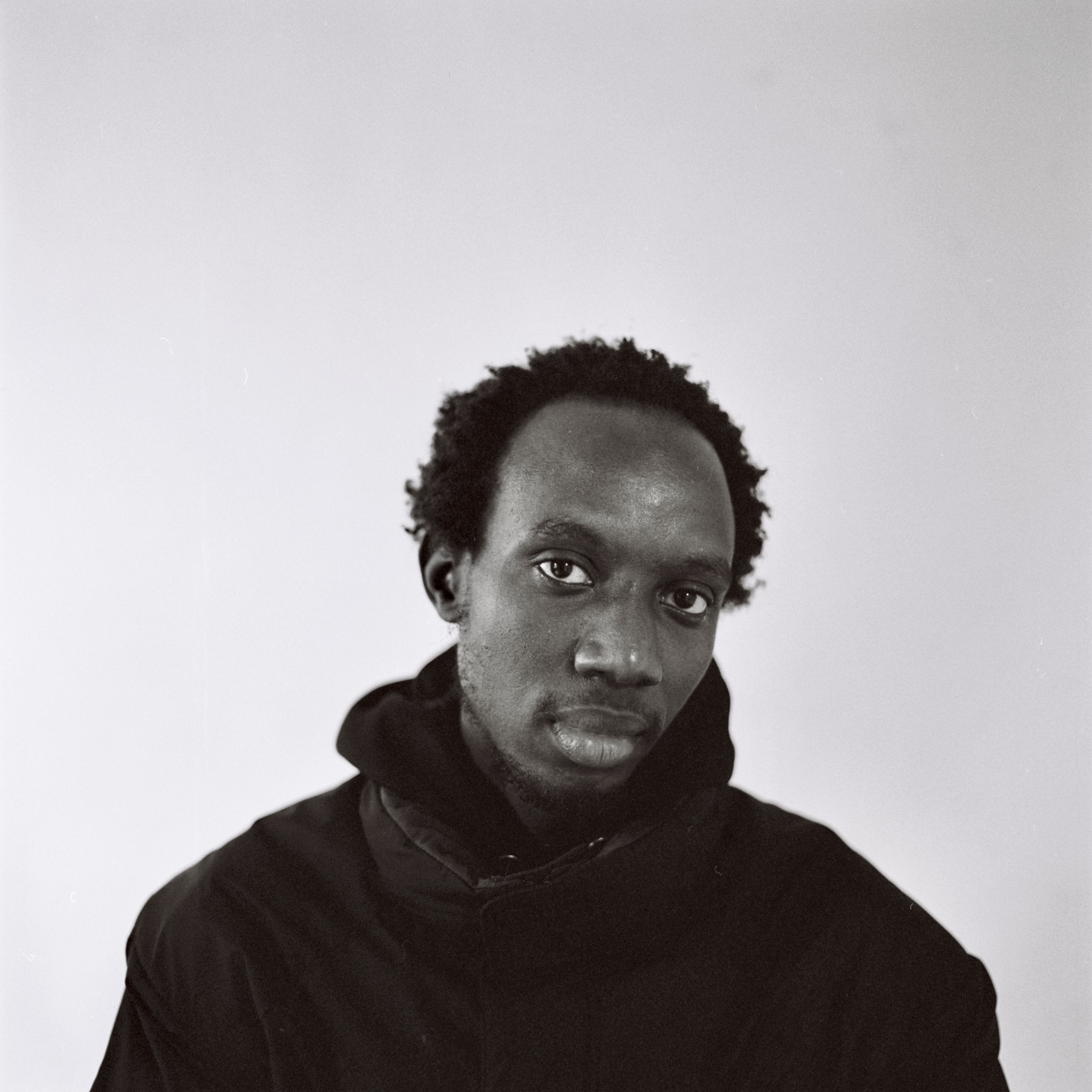 black and white portrait of music artist KMRU